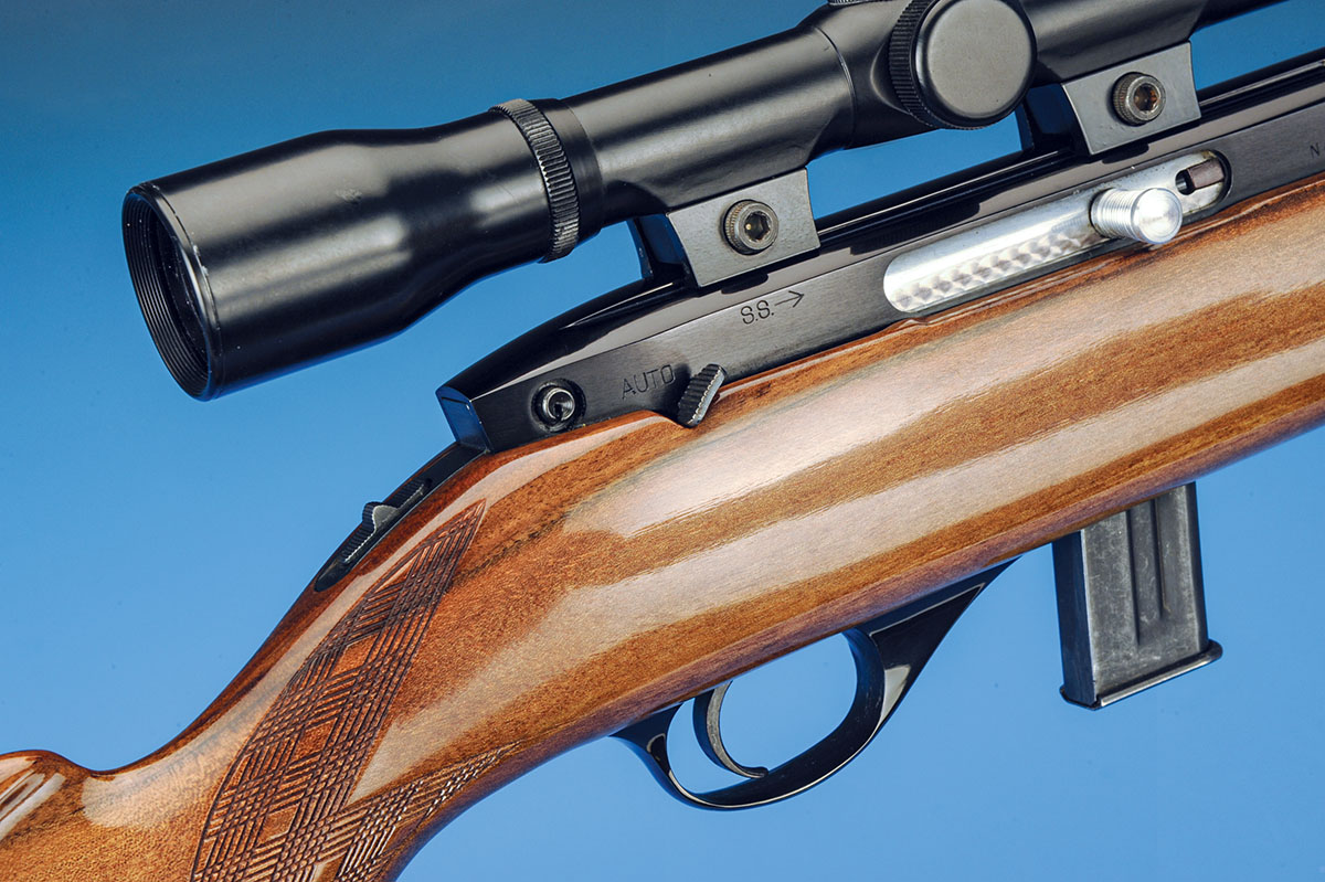 Moving forward, the thumb safety shows up here on the tang, plus the lever that allows the gun to be fired in semiautomatic or single-shot mode at the rear of the receiver. The magazine on this gun holds 10 rounds.